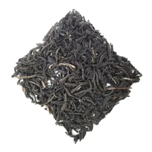 assam black tea loose leaf tea gathered on a white background